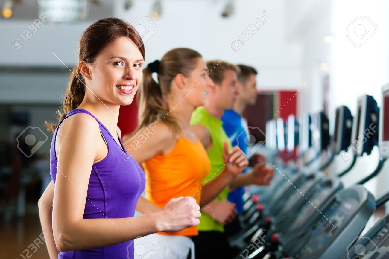 10448777-Running-on-treadmill-in-gym-or-fitness-club-group-of-women-and-men-exercising-to-gain-more-fitness-Stock-Photo